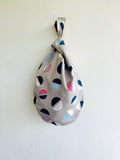Origami knot bag , reversible fabric small bag , wrist Japanese inspired eco friendly bag , cute weekend bag | Going round