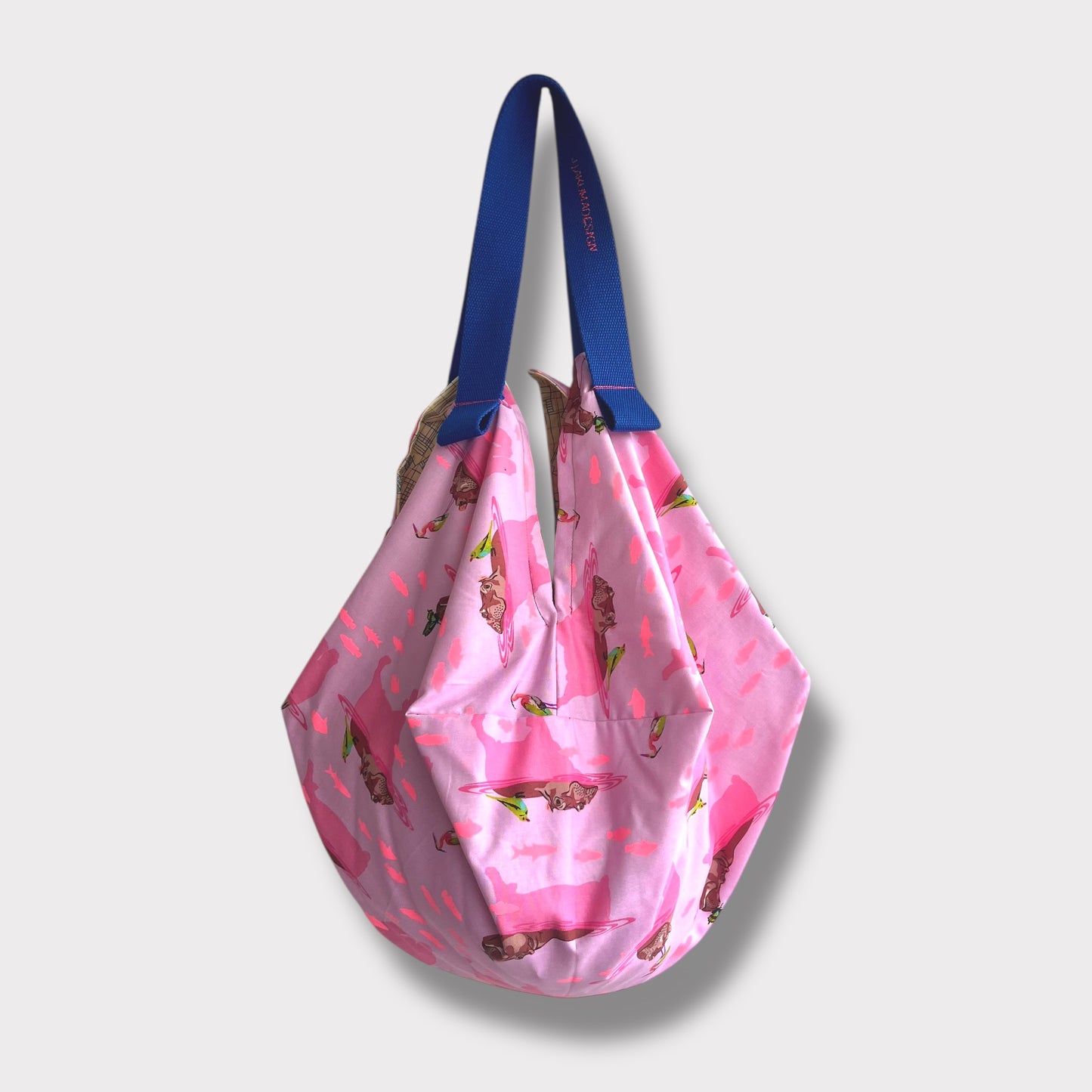 Mariko sac bag | The hippo & the butterfly swimming away from the yellow city landscape - Jiakuma