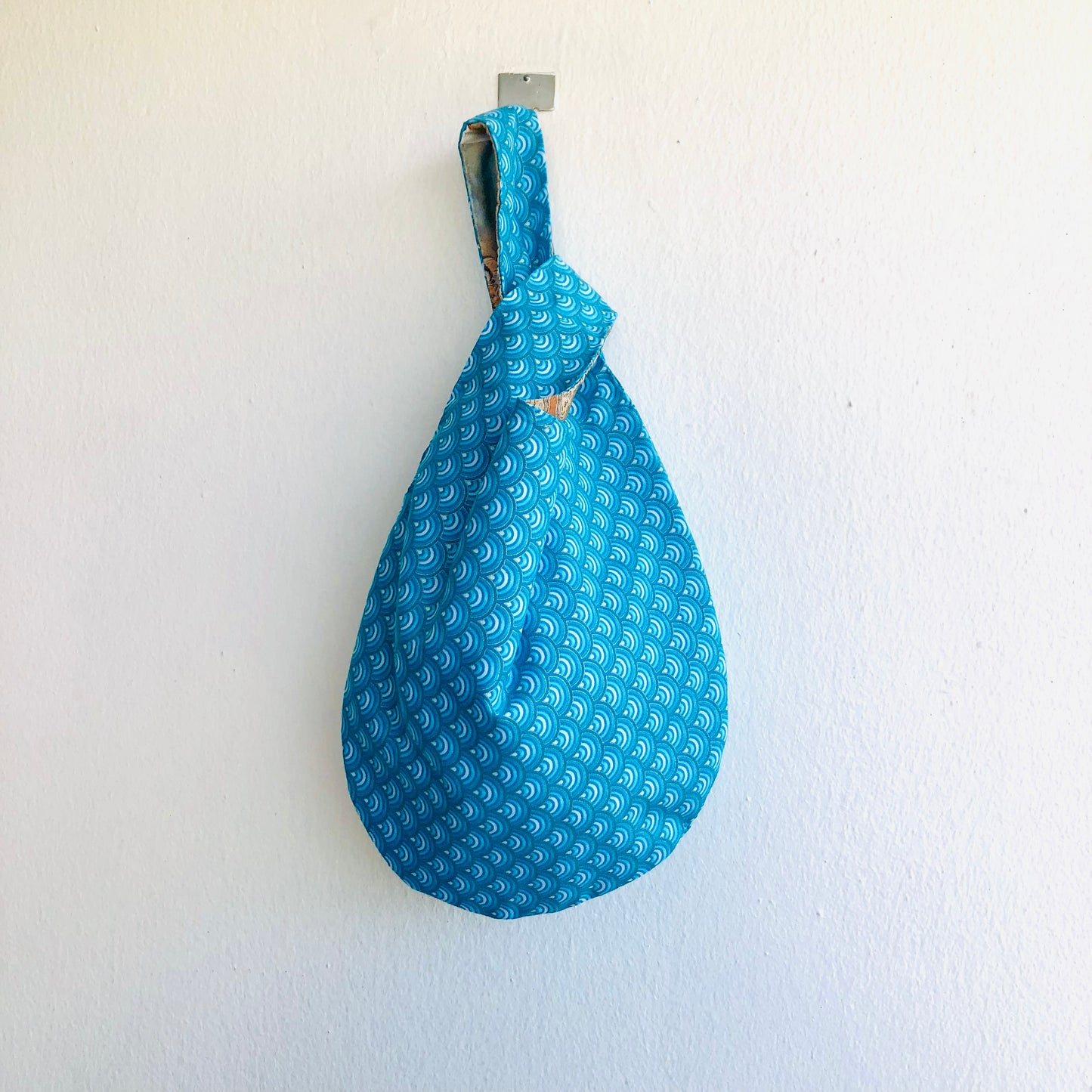 Cute small origami bag , handmade reversible knot bag , wrist fabric bag | Thin golden lines on a blue waves sea