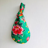 Reversible wrist small bag , knot fabric handmade bag | Peacocks walking through a rose flowers garden