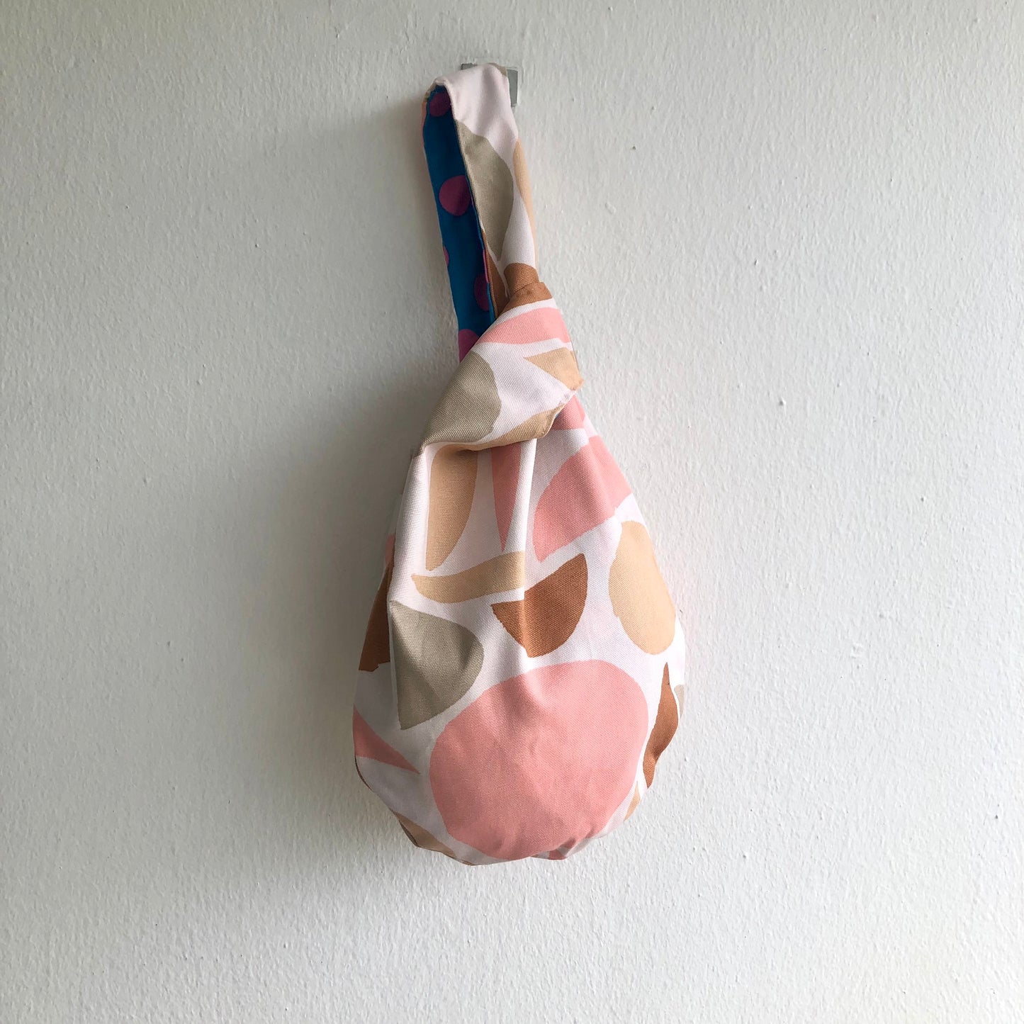 Small wrist origami bag , reversible Japanese inspired knot bag | Contemporary palette