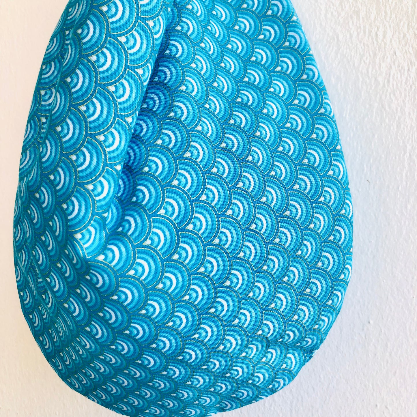 Cute small origami bag , handmade reversible knot bag , wrist fabric bag | Thin golden lines on a blue waves sea