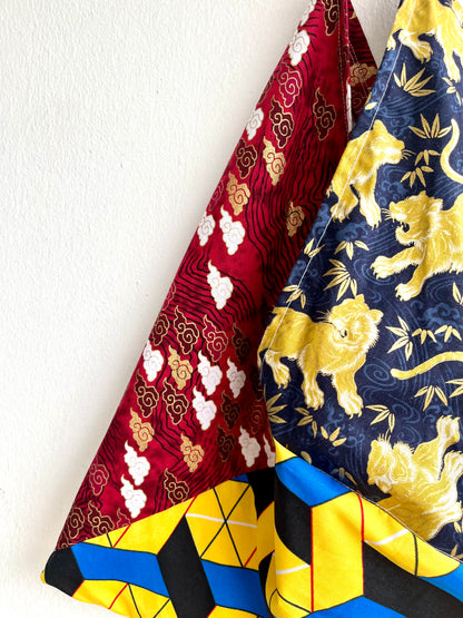 Bento bag | Golden dragons flying over the Japanese weaves on their way to Africa - Jiakuma