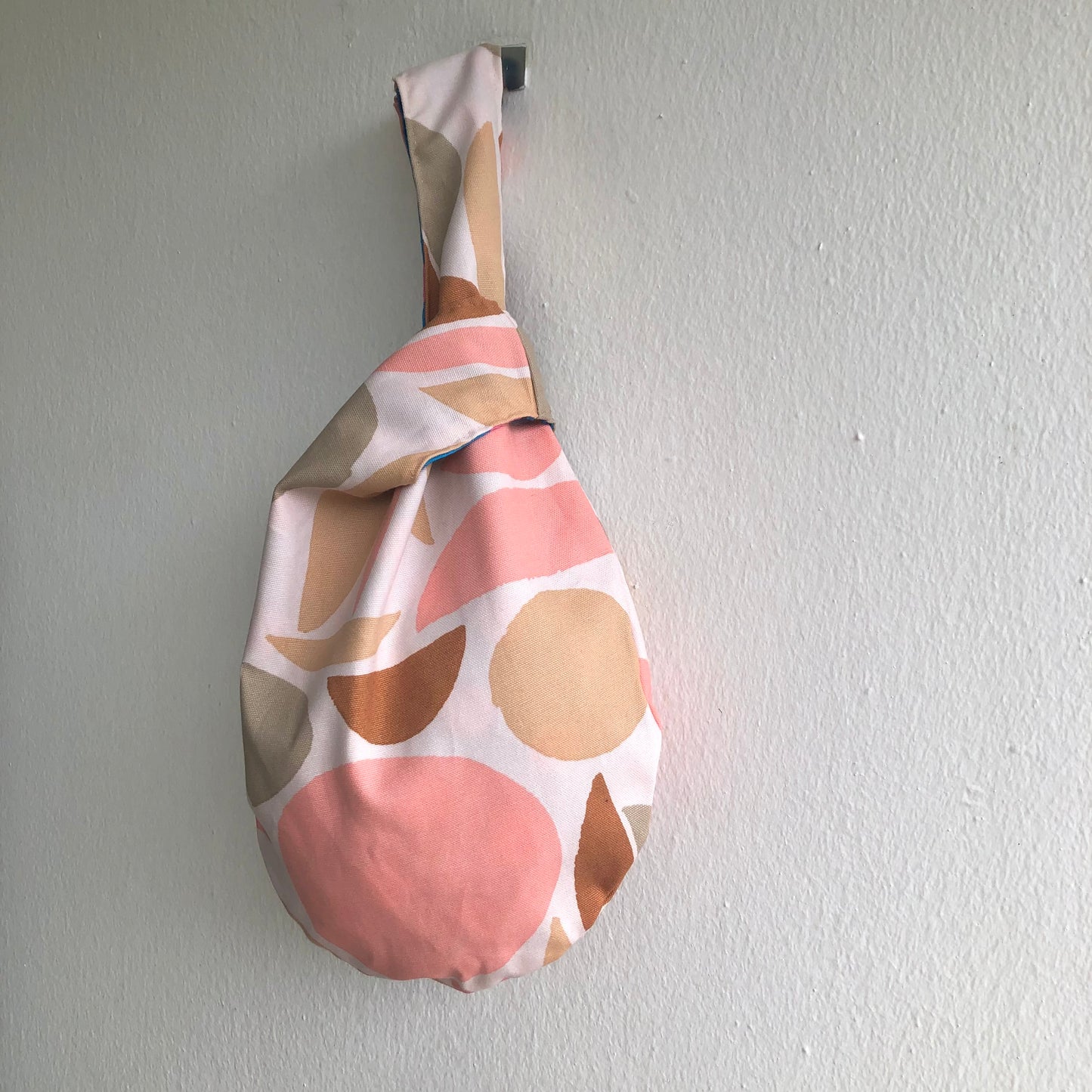 Small wrist origami bag , reversible Japanese inspired knot bag | Contemporary palette