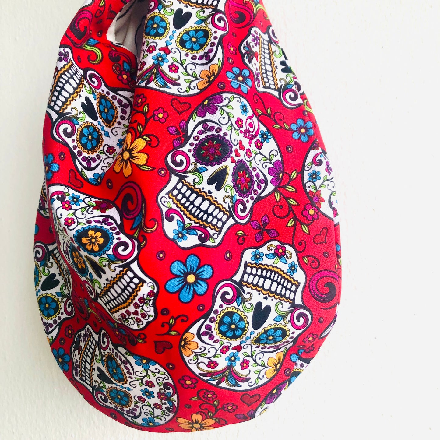 Knot origami bag , wrist reversible fabric colorful small bag , Japanese inspired bag | El Dia de los muertos & cubist ladies