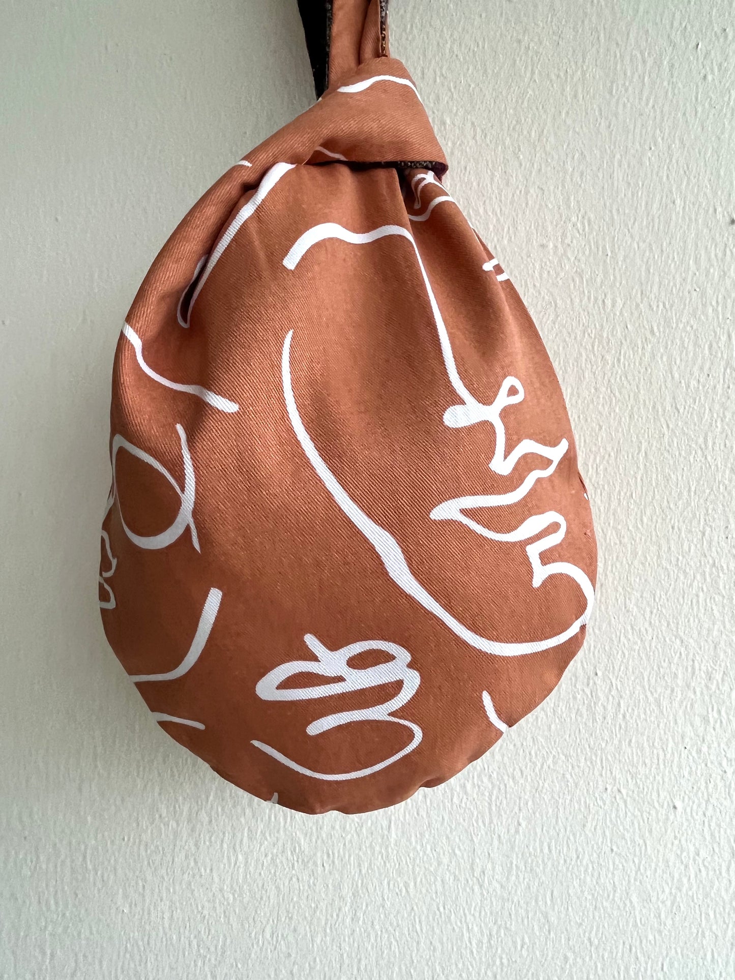 Origam knot bag , small wrist fabric bag , reversible cute Japanese bag , handmade gift idea | The faces of the desert - Jiakuma