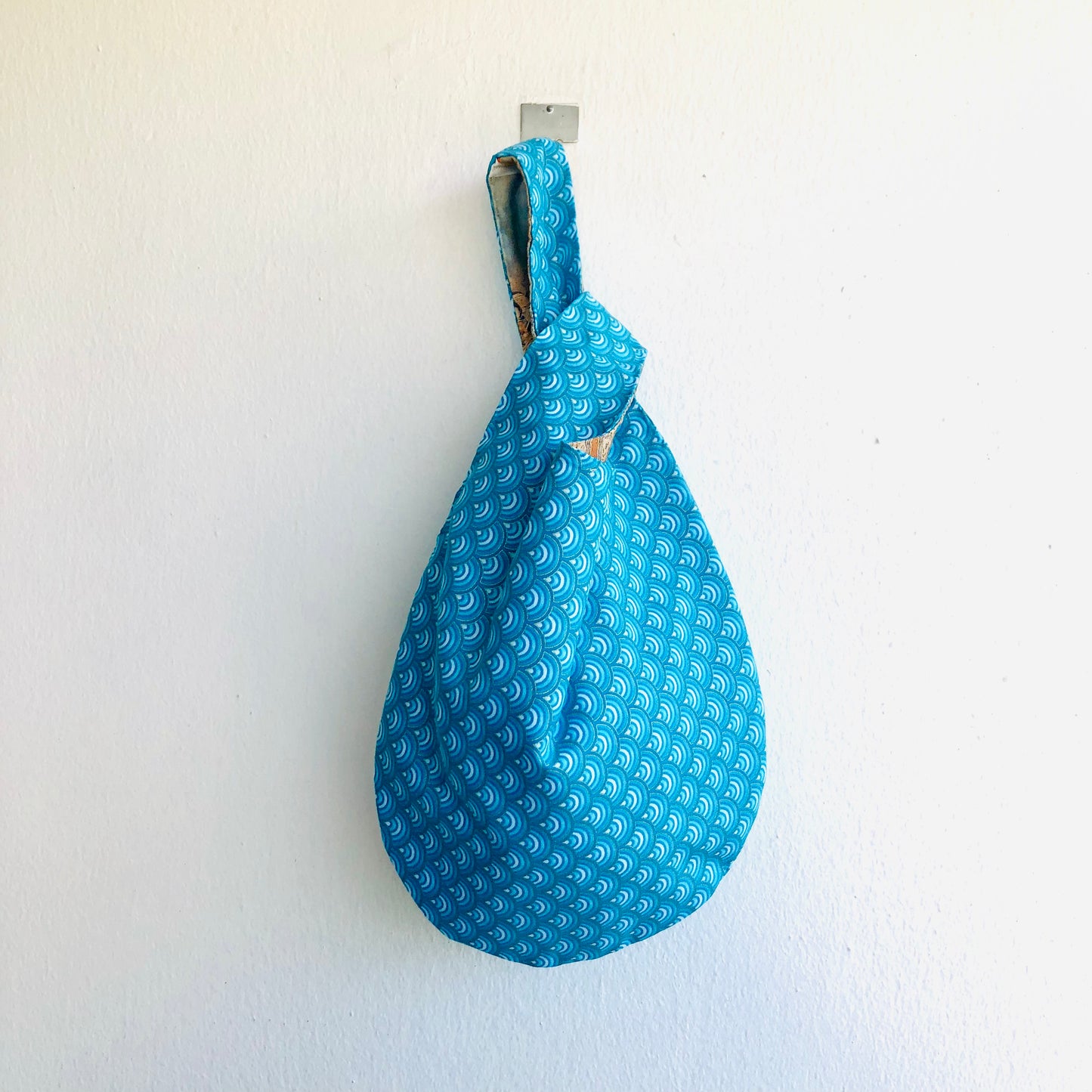 Cute small origami bag , handmade reversible knot bag , wrist fabric bag | Thin golden lines on a blue waves sea