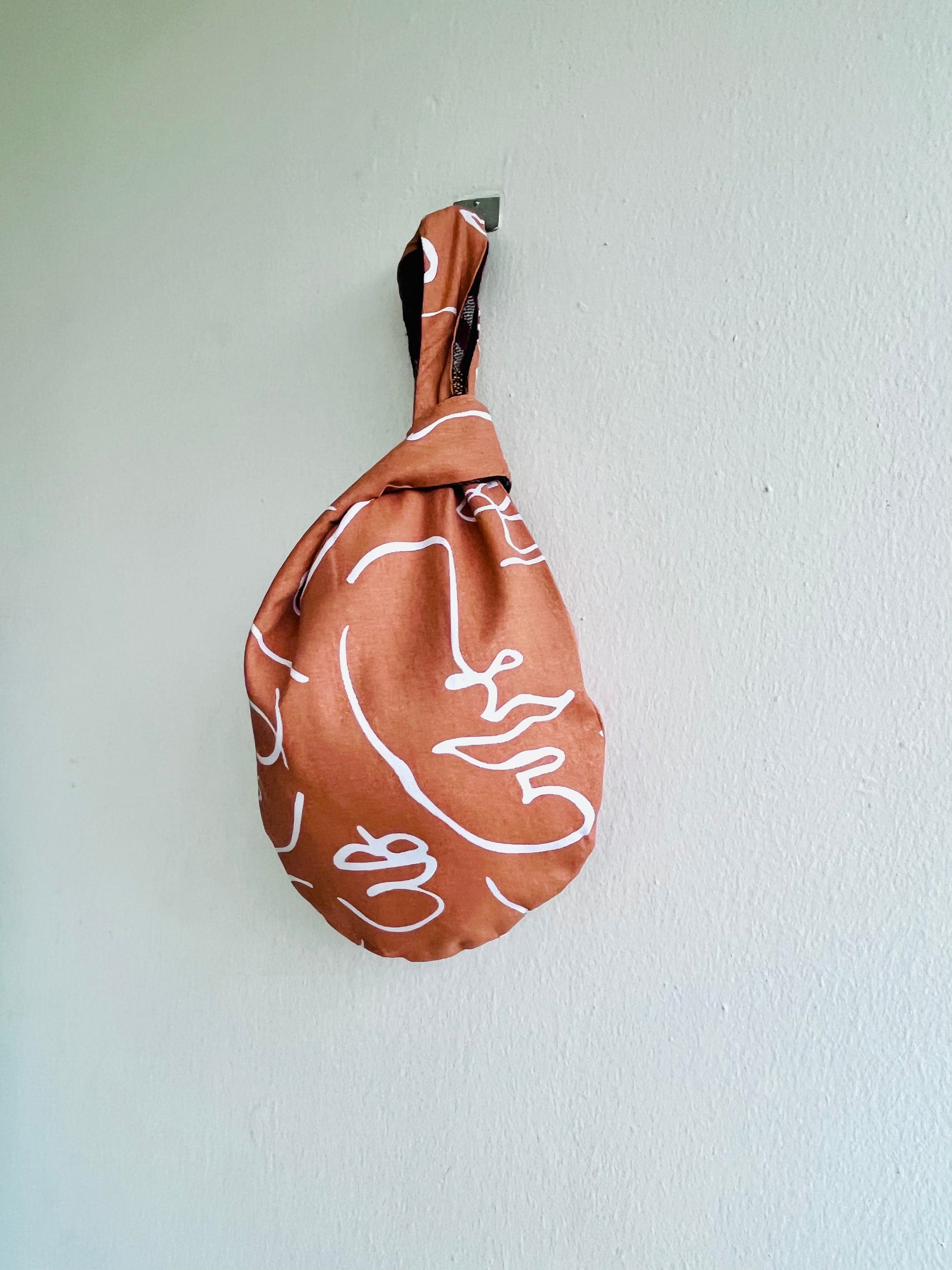 Origam knot bag , small wrist fabric bag , reversible cute Japanese bag , handmade gift idea | The faces of the desert - Jiakuma