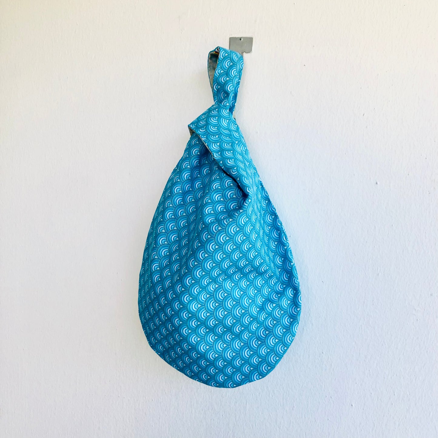 Cute small origami bag , handmade reversible knot bag , wrist fabric bag | Thin golden lines on a blue waves sea