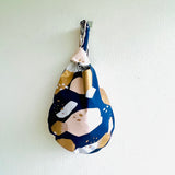 Origami small bag , knot Japanese fabric bag , colorful reversible wrist bag | Golden strokes city landscape