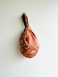 Origam knot bag , small wrist fabric bag , reversible cute Japanese bag , handmade gift idea | The faces of the desert